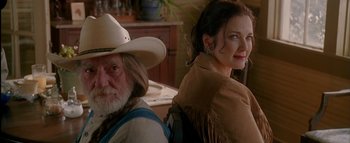 Movie still from “The Dukes of Hazzard” (2005), directed by Jay Chandrasekhar – An older man and a younger woman in cowboy hats; Medium shot, Over the shoulder angle
