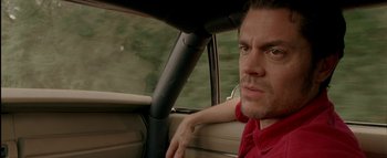 Movie still from “The Dukes of Hazzard” (2005), directed by Jay Chandrasekhar – A person in a car; Close Up shot, Over the shoulder angle