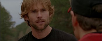 Movie still from “The Dukes of Hazzard” (2005), directed by Jay Chandrasekhar – A person with long blonde hair; Close Up shot, Over the shoulder angle