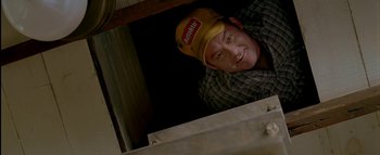 Movie still from “The Dukes of Hazzard” (2005), directed by Jay Chandrasekhar – A man wearing a hat and smiling for the camera; Close Up shot, Overhead angle