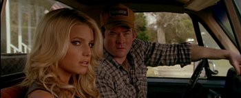 Movie still from “The Dukes of Hazzard” (2005), directed by Jay Chandrasekhar – A man and a woman sitting in the back of a car; Close Up shot, Over the shoulder angle