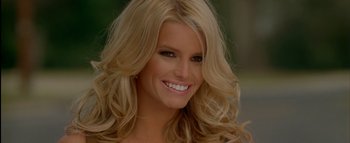 Movie still from “The Dukes of Hazzard” (2005), directed by Jay Chandrasekhar – A woman with long blonde hair smiling for the camera; Close Up shot, High angle