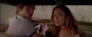 Movie still from “The Dukes of Hazzard” (2005), directed by Jay Chandrasekhar – A man and a woman in the back seat of a car; Close Up shot, Over the shoulder angle