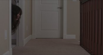 Movie still from “The Edge of Seventeen” (2016), directed by Kelly Fremon Craig – A door that is open in a room; Wide shot, High angle