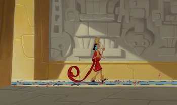 Movie still from “The Emperor's New Groove” (2000), directed by Mark Dindal – An animated woman walking in front of a building; Extreme Wide shot, Low angle