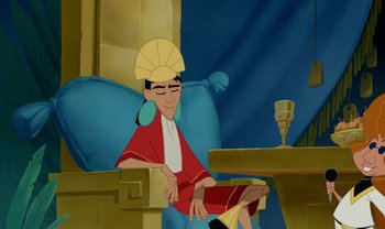 Movie still from “The Emperor's New Groove” (2000), directed by Mark Dindal – A man sitting at a table with a cup in front of him; Medium shot, Over the shoulder angle
