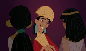 Movie still from “The Emperor's New Groove” (2000), directed by Mark Dindal – A group of people that are standing up; Close Up shot, Over the shoulder angle