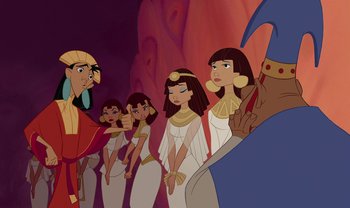 Movie still from “The Emperor's New Groove” (2000), directed by Mark Dindal – A group of people standing next to each other; Medium shot, Over the shoulder angle