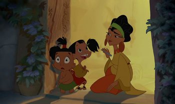 Movie still from “The Emperor's New Groove” (2000), directed by Mark Dindal – A group of kids sitting next to a woman; Medium shot, High angle