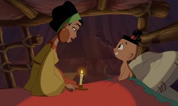 Movie still from “The Emperor's New Groove” (2000), directed by Mark Dindal – An animated scene of a woman sitting next to a child; Wide shot, High angle