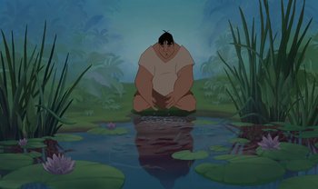 Movie still from “The Emperor's New Groove” (2000), directed by Mark Dindal – An animated picture of a man kneeling in front of a body of water; Wide shot, Low angle
