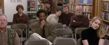 Movie still from “The End of the Tour” (2015), directed by James Ponsoldt – A group of people sitting in a room; Medium shot, High angle