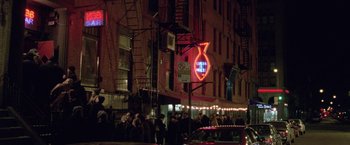 Movie still from “The End of the Tour” (2015), directed by James Ponsoldt – A group of people standing on the side of a building; Extreme Wide shot, High angle