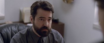 Movie still from “The End of the Tour” (2015), directed by James Ponsoldt – A person with a beard wearing a tie; Close Up shot, High angle