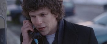 Movie still from “The End of the Tour” (2015), directed by James Ponsoldt – A person talking on a cell phone; Close Up shot, Over the shoulder angle