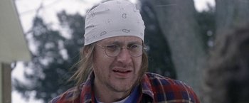 Movie still from “The End of the Tour” (2015), directed by James Ponsoldt – A person wearing glasses and a bandana; Close Up shot, Low angle