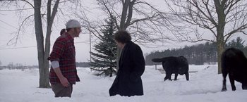 Movie still from “The End of the Tour” (2015), directed by James Ponsoldt – Two people standing in the middle of a snow covered field; Wide shot, Over the shoulder angle