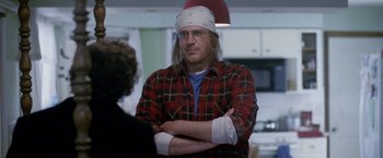 Movie still from “The End of the Tour” (2015), directed by James Ponsoldt – A man wearing a bandage on his head; Medium shot, Over the shoulder angle