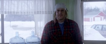 Movie still from “The End of the Tour” (2015), directed by James Ponsoldt – A man wearing a white hat and a plaid shirt; Medium shot, Low angle