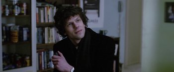 Movie still from “The End of the Tour” (2015), directed by James Ponsoldt – A man in a black jacket and a black scarf; Close Up shot, Over the shoulder angle