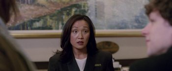 Movie still from “The End of the Tour” (2015), directed by James Ponsoldt – A woman in a black jacket and a white shirt; Close Up shot, Over the shoulder angle