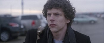 Movie still from “The End of the Tour” (2015), directed by James Ponsoldt – A person wearing a jacket; Close Up shot, Over the shoulder angle