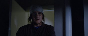 Movie still from “The End of the Tour” (2015), directed by James Ponsoldt – A man with a bandage on his head is looking at the camera; Close Up shot, Low angle