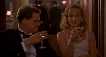 Movie still from “The English Patient” (1996), directed by Anthony Minghella – A man and a woman sitting at a table holding wine glasses; Medium shot, Over the shoulder angle