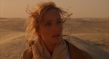 Movie still from “The English Patient” (1996), directed by Anthony Minghella – A person wearing a jacket; Close Up shot, Over the shoulder angle