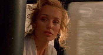 Movie still from “The English Patient” (1996), directed by Anthony Minghella – A person looking at a mirror; Close Up shot, Low angle
