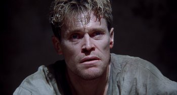 Movie still from “The English Patient” (1996), directed by Anthony Minghella – A person wearing a shirt; Close Up shot, Low angle