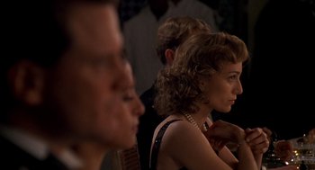 Movie still from “The English Patient” (1996), directed by Anthony Minghella – A woman sitting next to a man in front of a mirror; Close Up shot, Over the shoulder angle