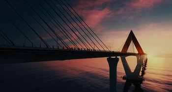 Movie still from “The Fabelmans” (2022), directed by Steven Spielberg – A view of a bridge that is over a body of water at sunset; Extreme Wide shot, Low angle