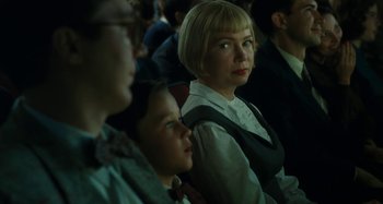 Movie still from “The Fabelmans” (2022), directed by Steven Spielberg – A woman sitting next to a child in a crowd; Close Up shot, Over the shoulder angle