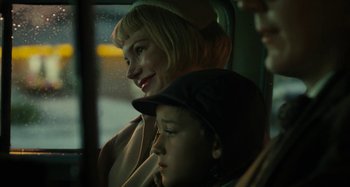 Movie still from “The Fabelmans” (2022), directed by Steven Spielberg – A woman and a boy sitting in a car; Close Up shot, Over the shoulder angle