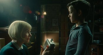 Movie still from “The Fabelmans” (2022), directed by Steven Spielberg – A woman and a boy are holding a camera; Close Up shot, Low angle