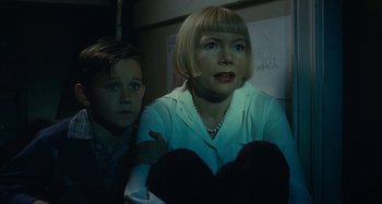 Movie still from “The Fabelmans” (2022), directed by Steven Spielberg – A woman sitting next to a young boy in front of a whiteboard; Close Up shot, Low angle