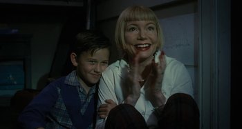 Movie still from “The Fabelmans” (2022), directed by Steven Spielberg – A woman and a young boy sitting next to each other; Close Up shot, Low angle