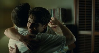 Movie still from “The Fabelmans” (2022), directed by Steven Spielberg – A young man holding his arm around another young man's shoulder; Close Up shot, Over the shoulder angle