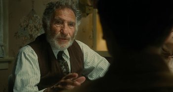 Movie still from “The Fabelmans” (2022), directed by Steven Spielberg – An older man wearing a vest and tie talking to a younger man; Close Up shot, Over the shoulder angle