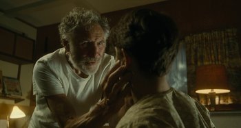 Movie still from “The Fabelmans” (2022), directed by Steven Spielberg – An older man looking at a younger man in the mirror; Close Up shot, Over the shoulder angle