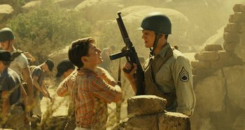 Movie still from “The Fabelmans” (2022), directed by Steven Spielberg – Two young men are standing next to each other; Medium shot, Over the shoulder angle