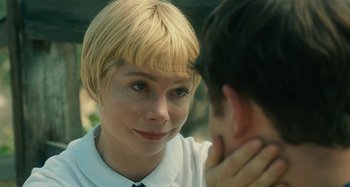 Movie still from “The Fabelmans” (2022), directed by Steven Spielberg – A woman with blonde hair is looking at a man with short black hair; Close Up shot, Over the shoulder angle