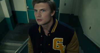 Movie still from “The Fabelmans” (2022), directed by Steven Spielberg – A young man in a letterman's jacket looks into the camera; Close Up shot, Over the shoulder angle