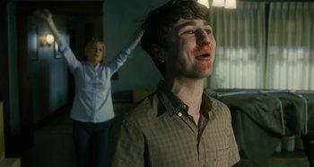 Movie still from “The Fabelmans” (2022), directed by Steven Spielberg – A man and a woman in a living room; Medium shot, Low angle