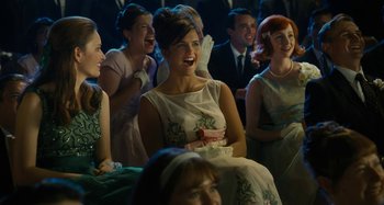 Movie still from “The Fabelmans” (2022), directed by Steven Spielberg – A group of people sitting in front of each other laughing; Medium shot, Over the shoulder angle