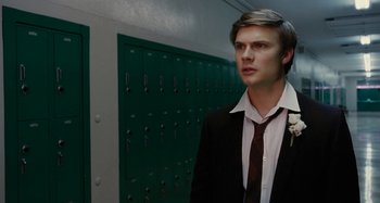 Movie still from “The Fabelmans” (2022), directed by Steven Spielberg – A man in a suit and tie standing in front of green lockers; Close Up shot, Low angle