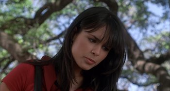Movie still from “The Faculty” (1998), directed by Robert Rodriguez – A person with long black hair; Close Up shot, High angle