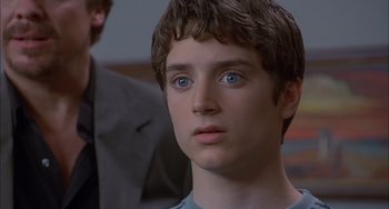 Movie still from “The Faculty” (1998), directed by Robert Rodriguez – A person with blue eyes; Close Up shot, Over the shoulder angle