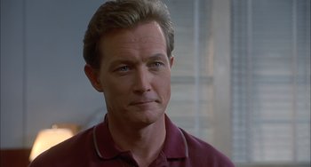 Movie still from “The Faculty” (1998), directed by Robert Rodriguez – A person wearing a red shirt; Close Up shot, Low angle